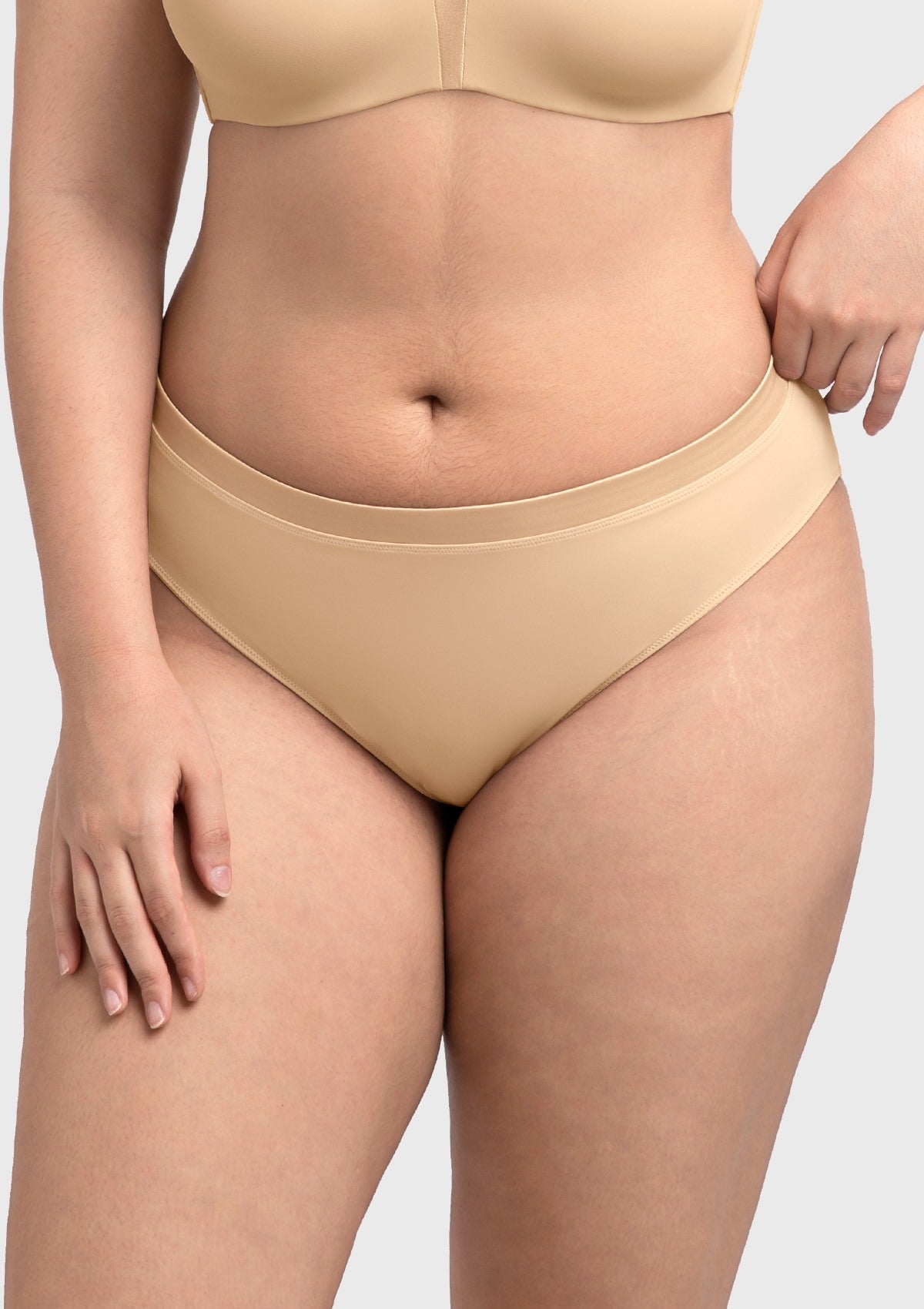 Beige Fiery high-rise cotton bikini underwear on model, front view, designed for a flattering and comfortable fit.