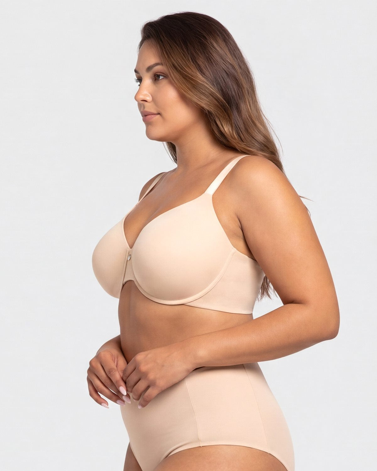 Side profile of the Light Beige minimizer bra on model, highlighting the gentle yet firm underwire support and seamless bonded edges for all-day shaping.