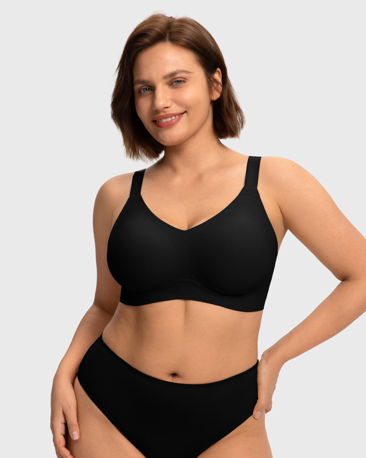 Front view of model wearing the HSIA black SoftTouch wireless jelly fit bra, featuring a sleek V-neckline and seamless everyday comfort for fuller figures.