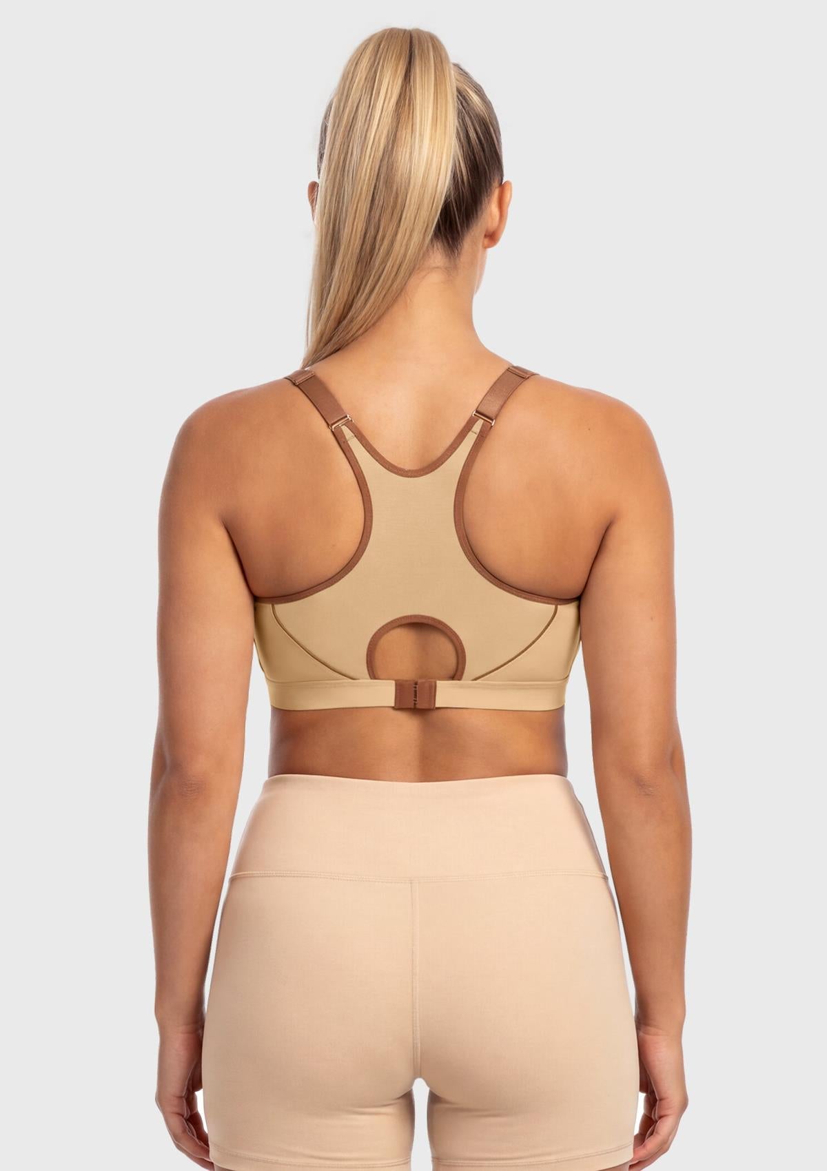 Rear view of the Warm Beige high impact sports bra on model, showing the adjustable underband tension that perfectly respects full-figured curves.
