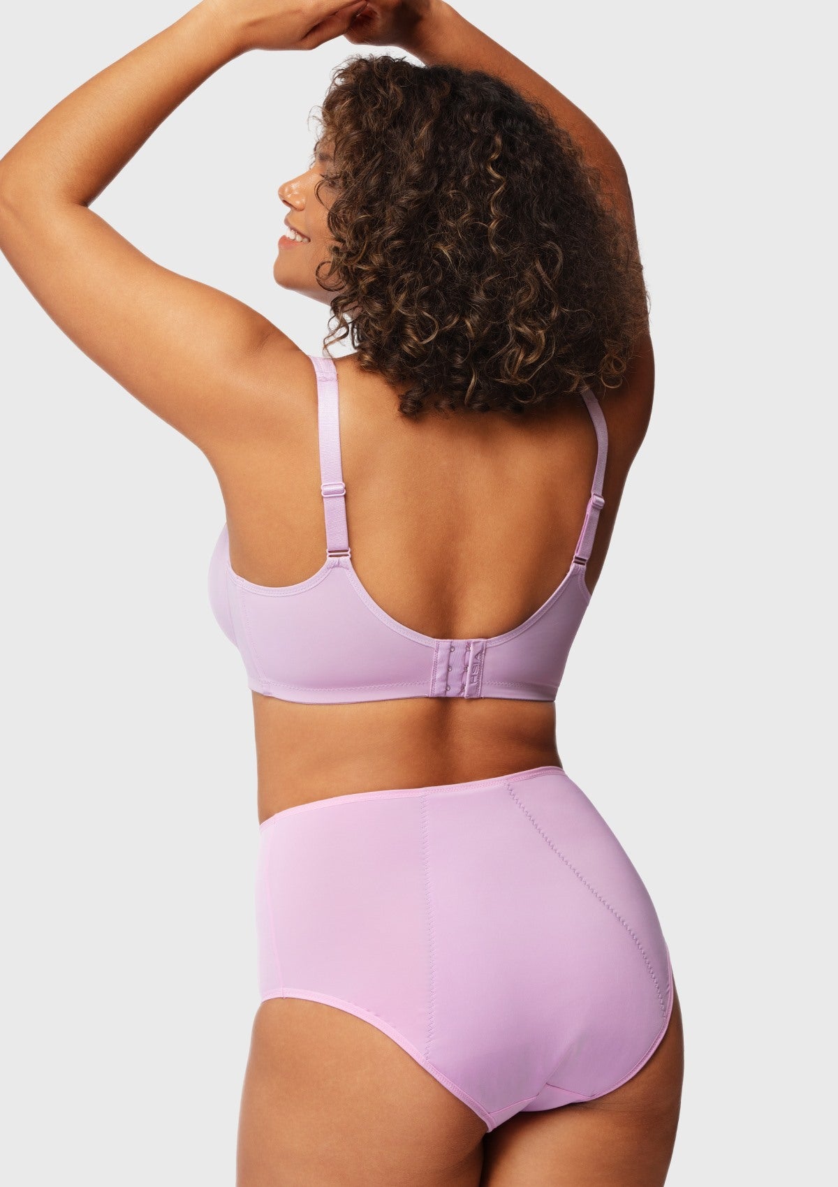 Back view of the lavender back smoothing minimizer bra, featuring specialized hook closures that vanish under clingy tees.