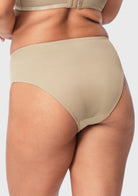 Side angle of model in Natural Nude Bella mesh panties, showing the flattering mid-low rise silhouette.