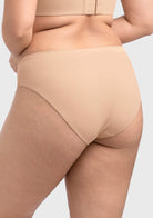 Back view of Almond Beige Fiery high-rise bikini on model, ensuring a seamless look under clothing.