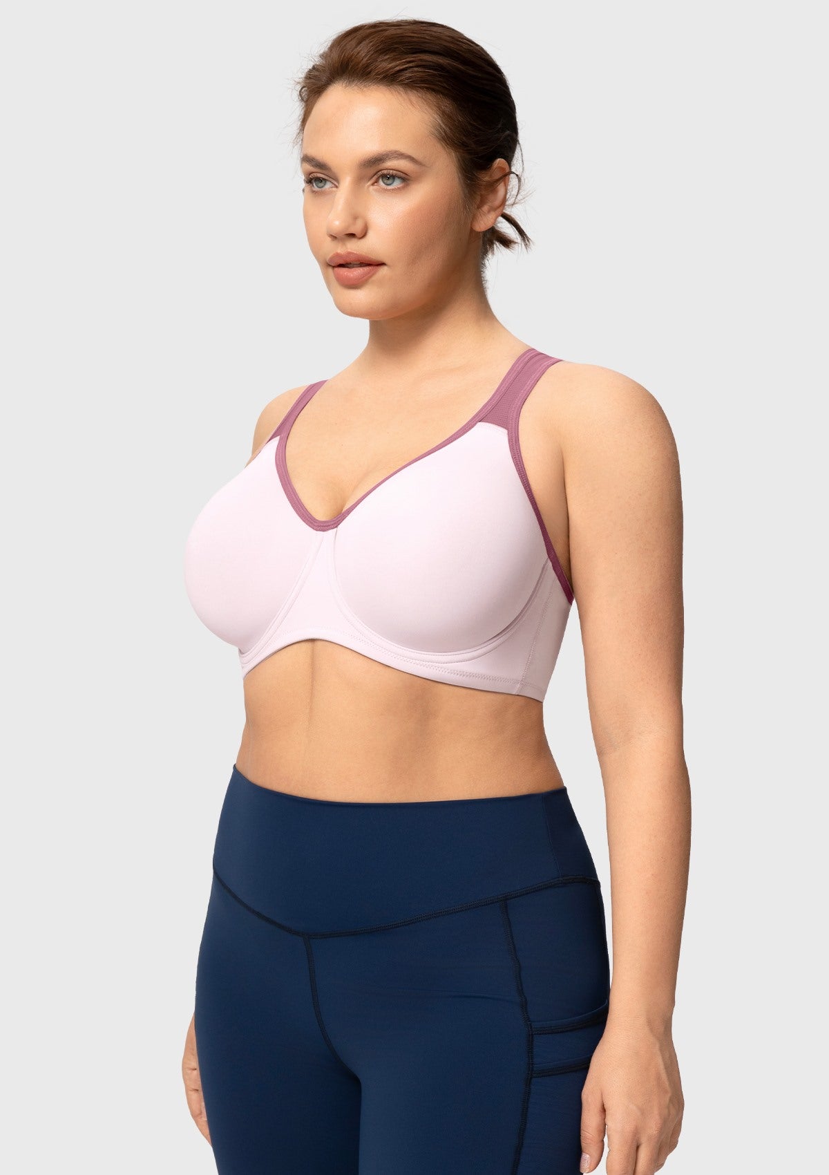 45-degree angle of the Light Purple HSIA unlined sports bra, highlighting the natural breast shape and excellent encapsulation without bulky padding.
