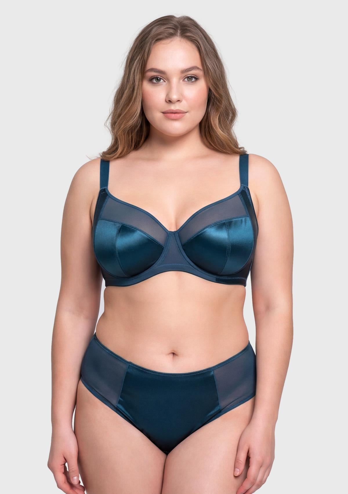 Front view of model wearing the vibrant Ocean Blue HSIA Lunaire shimmer unlined bra, featuring sensual sheer mesh and heavy-duty support up to L cup.