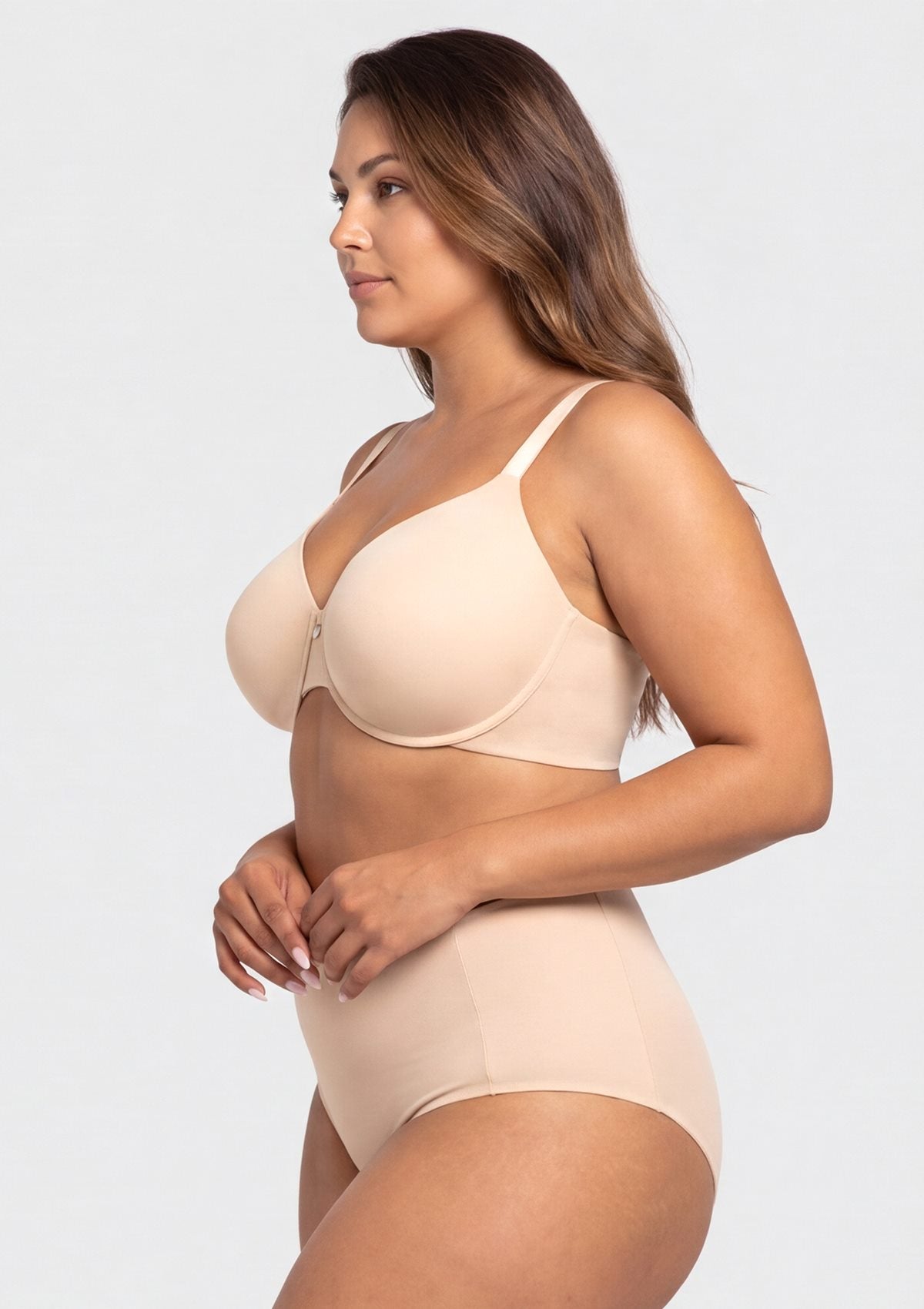 Side profile of the Light Beige minimizer bra on model, highlighting the gentle yet firm underwire support and seamless bonded edges for all-day shaping.